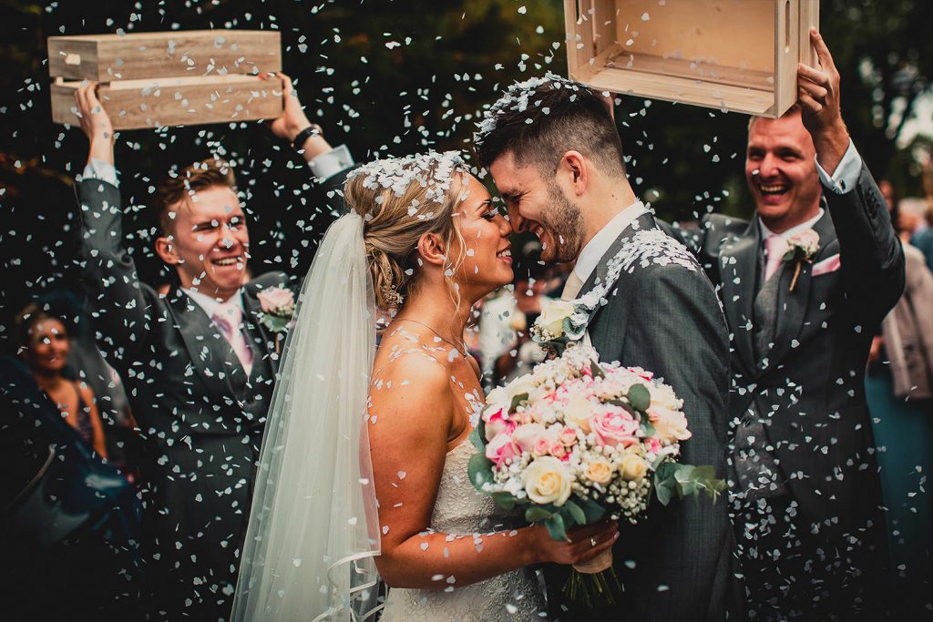 Wedding couple with confetti