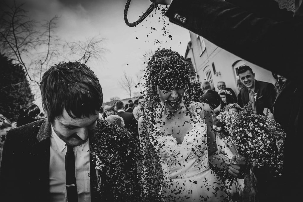 Wedding couple with confetti