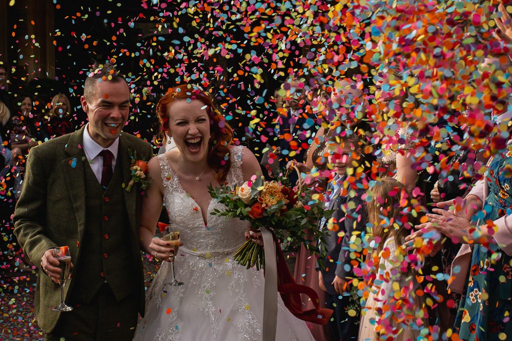 Wedding couple with confetti