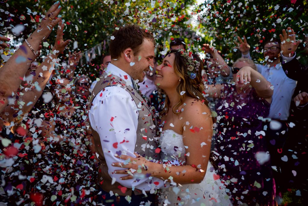 Bride and groom with confetti