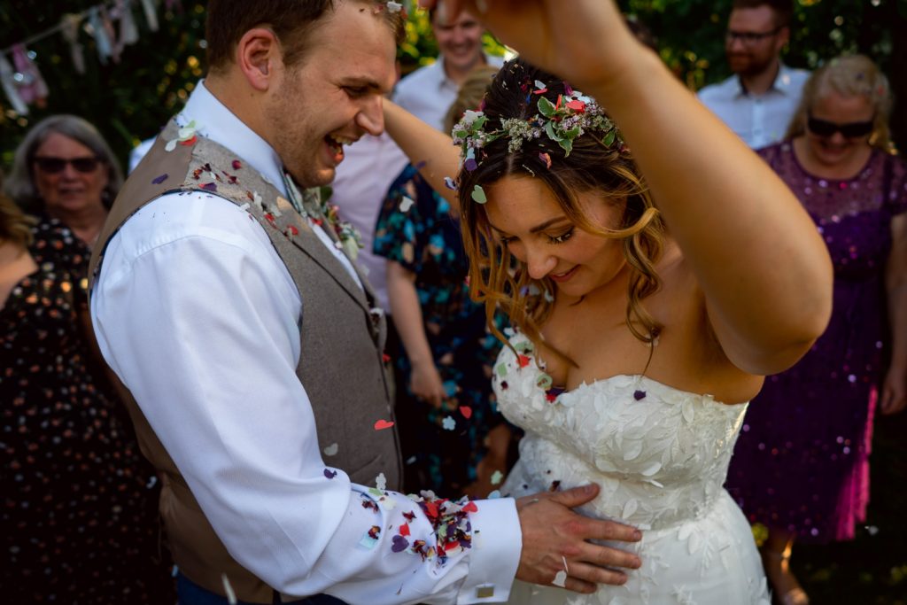 Bride and groom with confetti