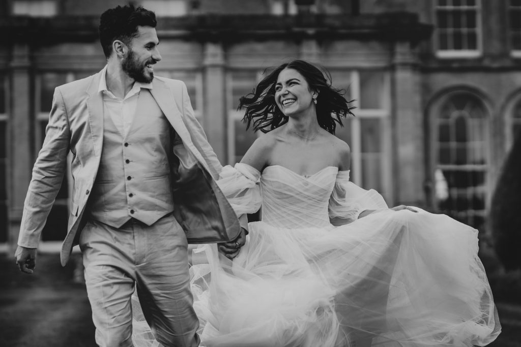 Wedding couple running