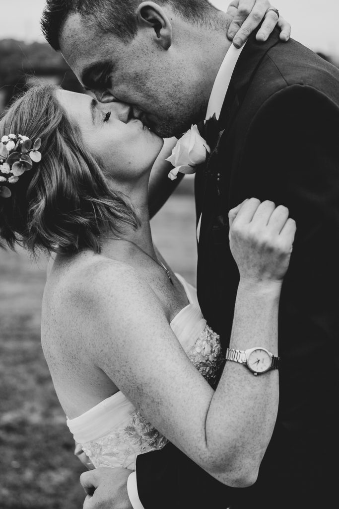 Bride and groom kissing