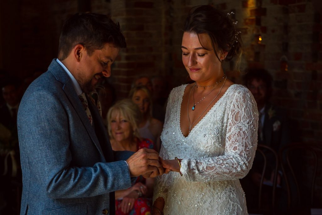 Bride and groom exchange rings