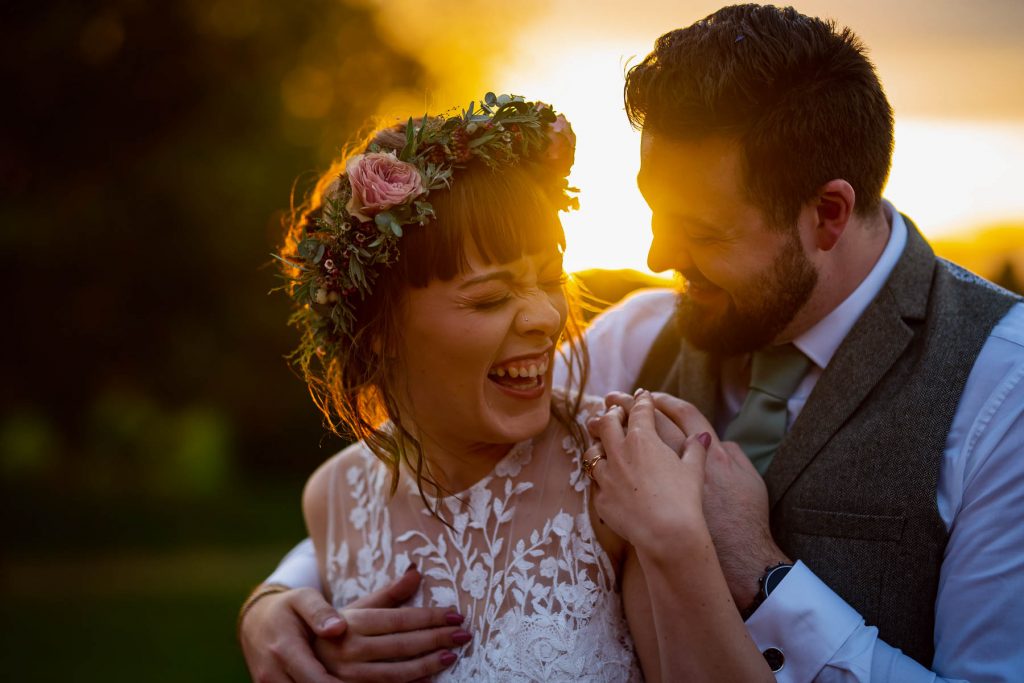 Bride and groom laughing