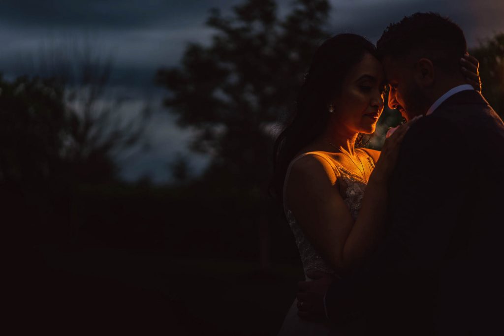 Couple hugging in woods