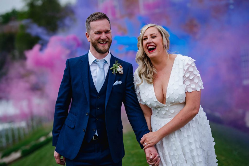 Bride and groom with smoke bombs