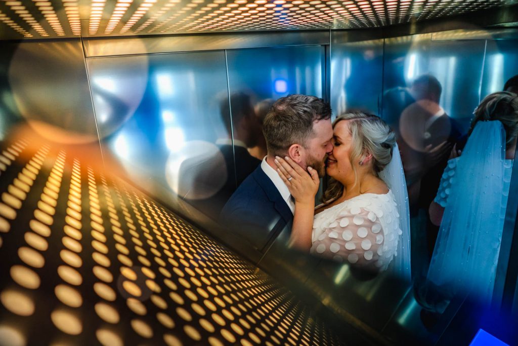 Bride and groom in lift