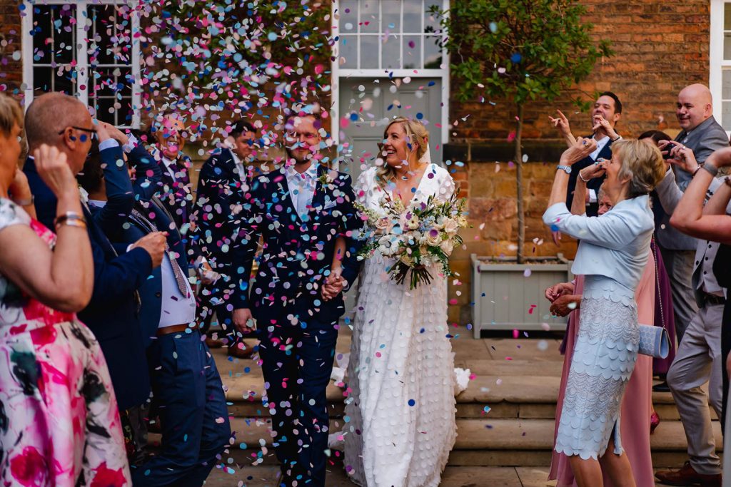 Bride and groom in confetti