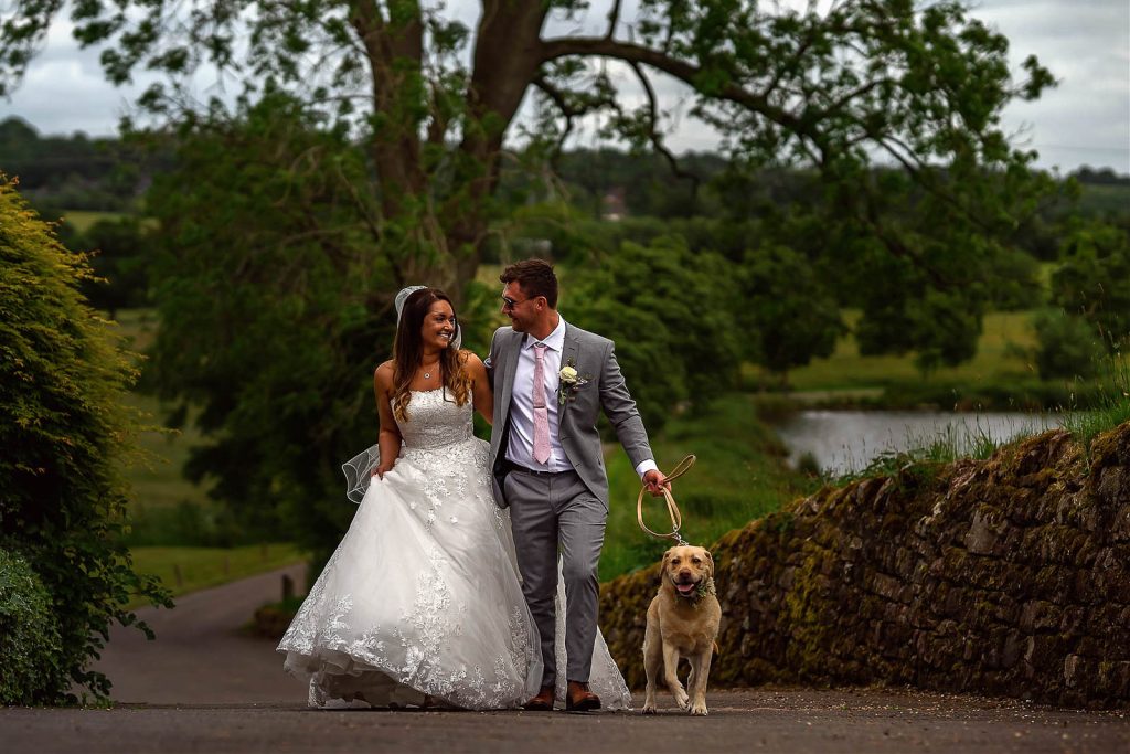 Couple with dog at wedding
