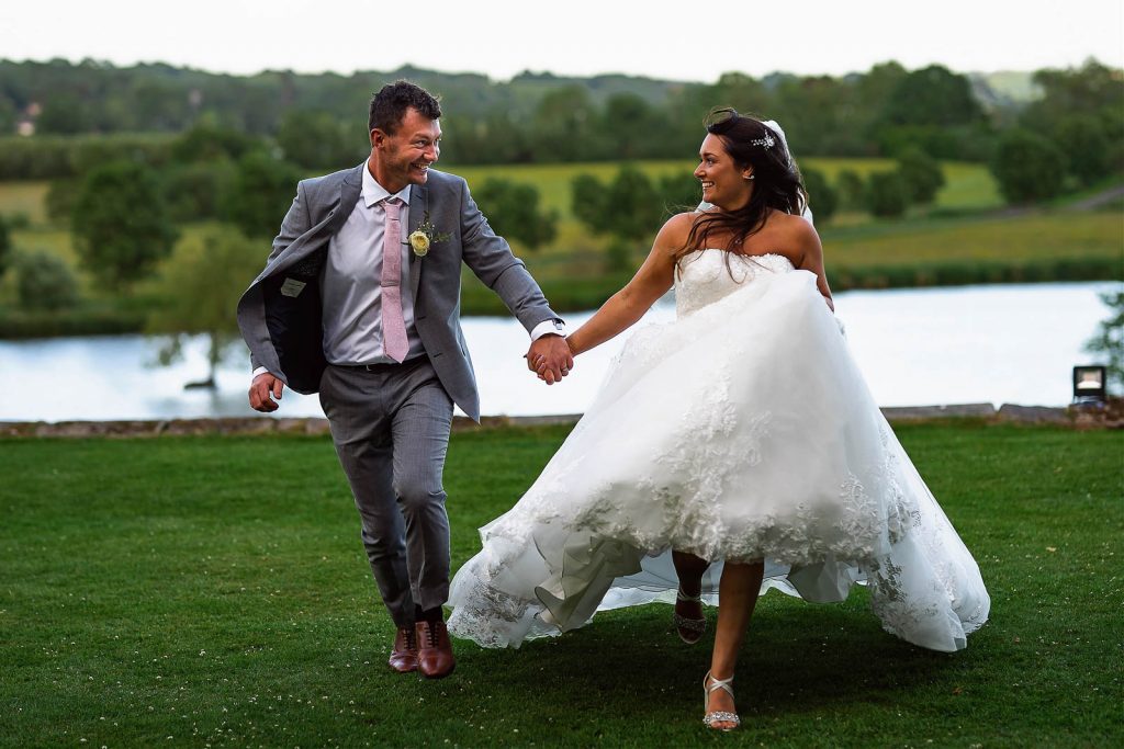 wedding couple running