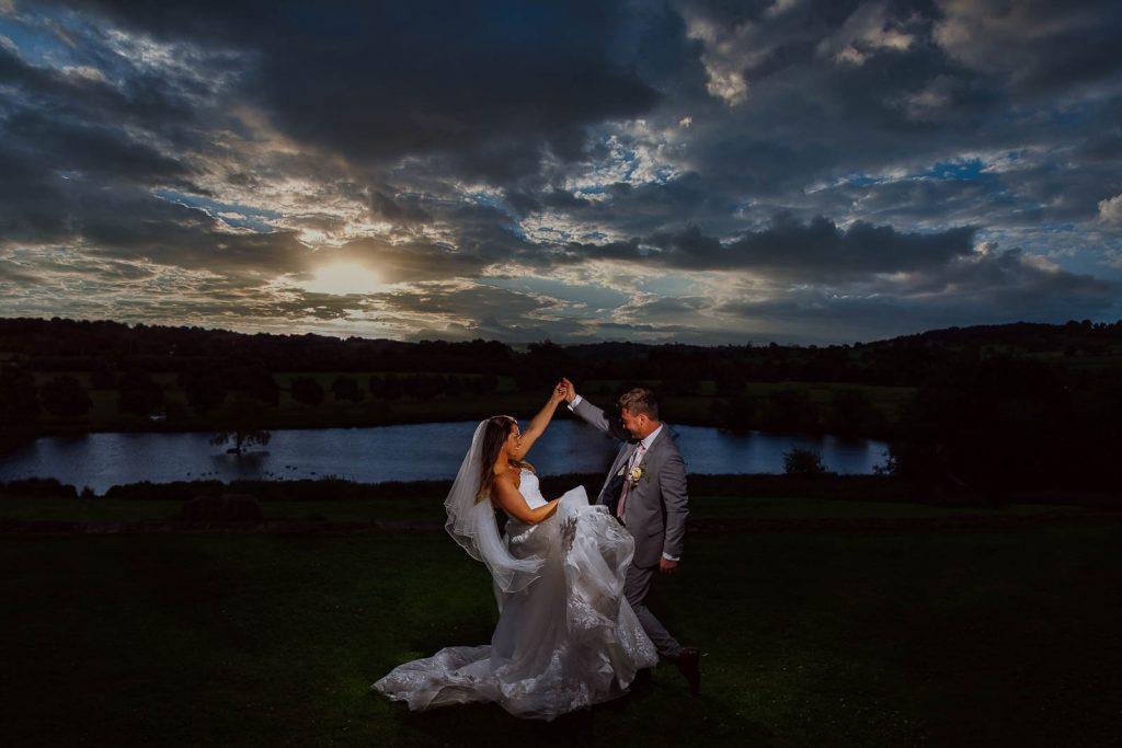 Couple dancing at wedding outside