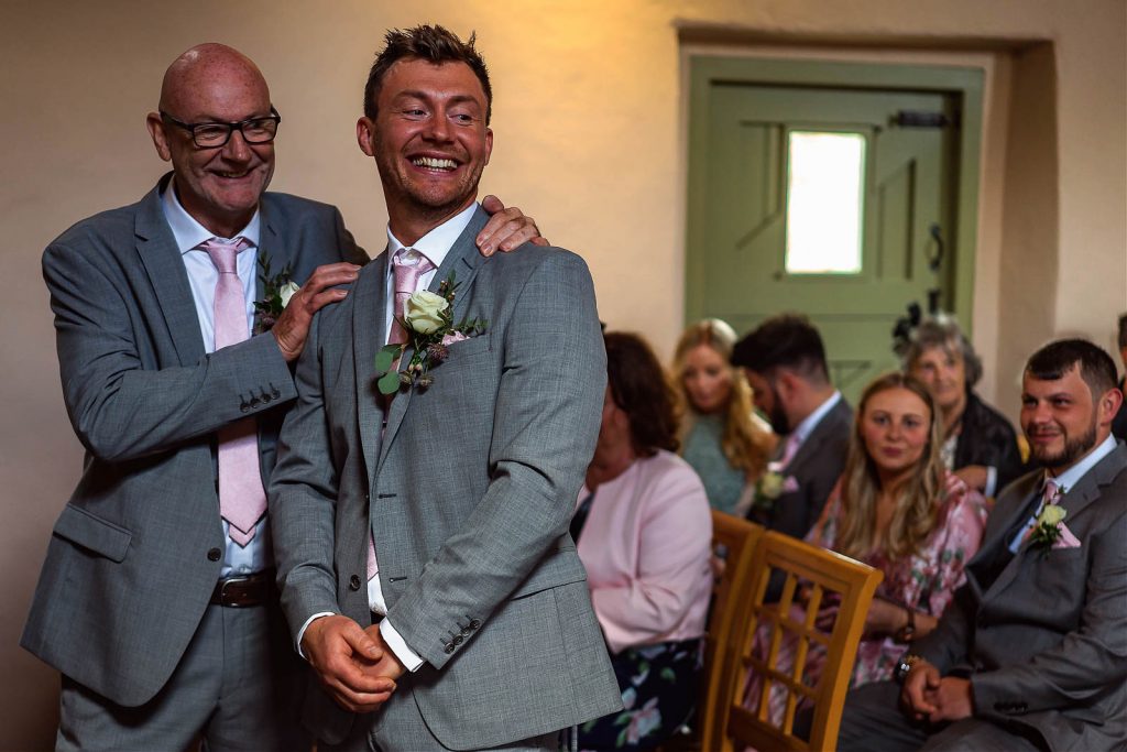 Groom at alter