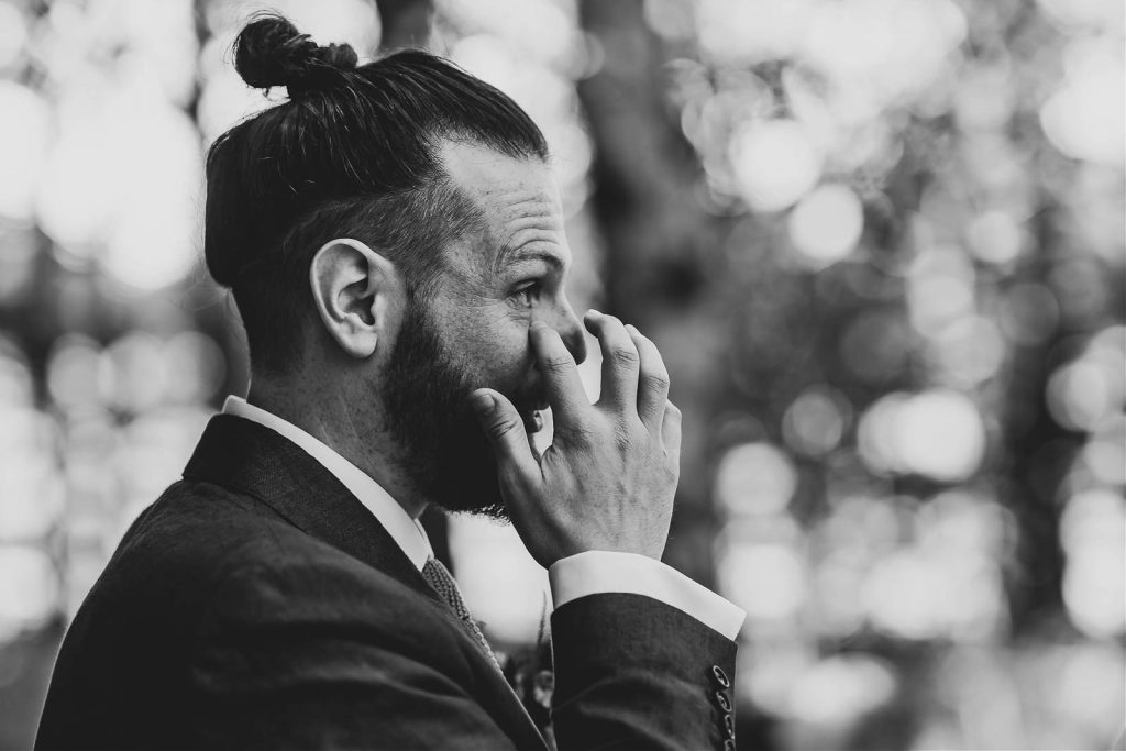 Groom at alter crying