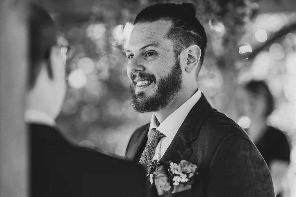 Groom smiling