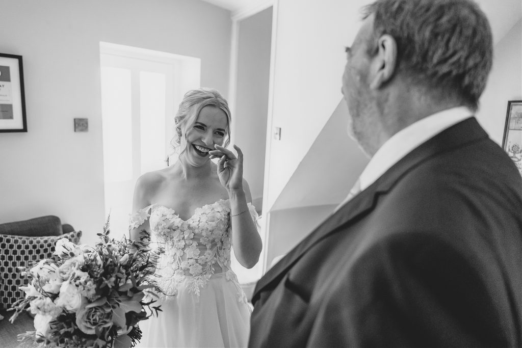 bride first look with dad