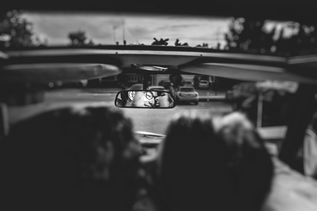 Bride and groom in car