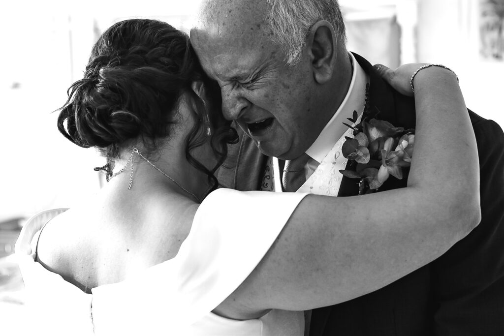 Father of bride crying