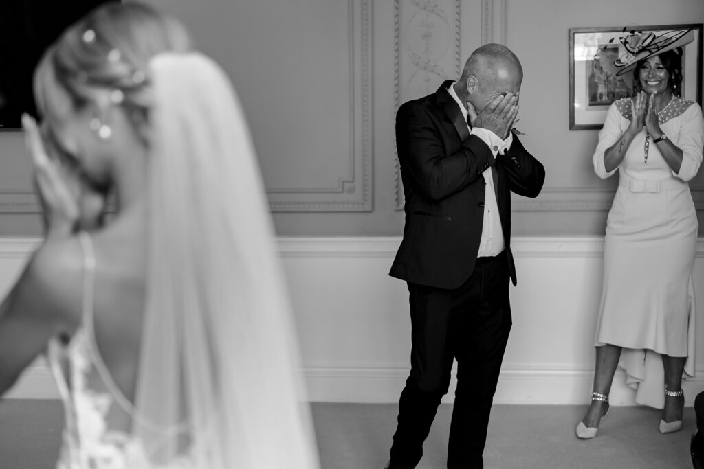 Bride getting ready with dad first look