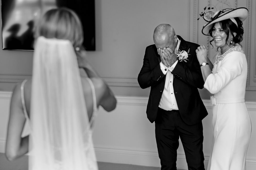 Bride getting ready with dad first look