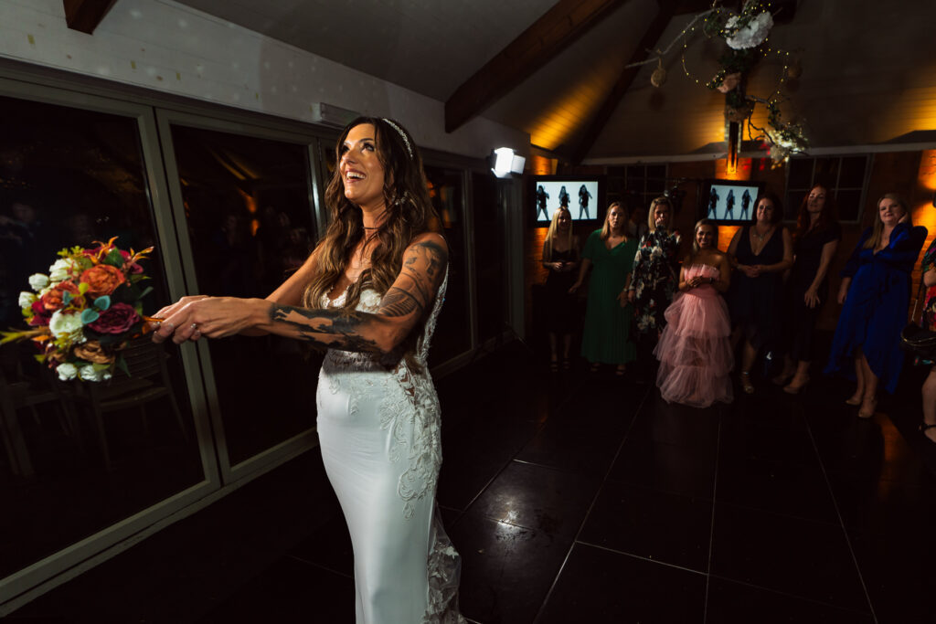 Bride throwing her flowers