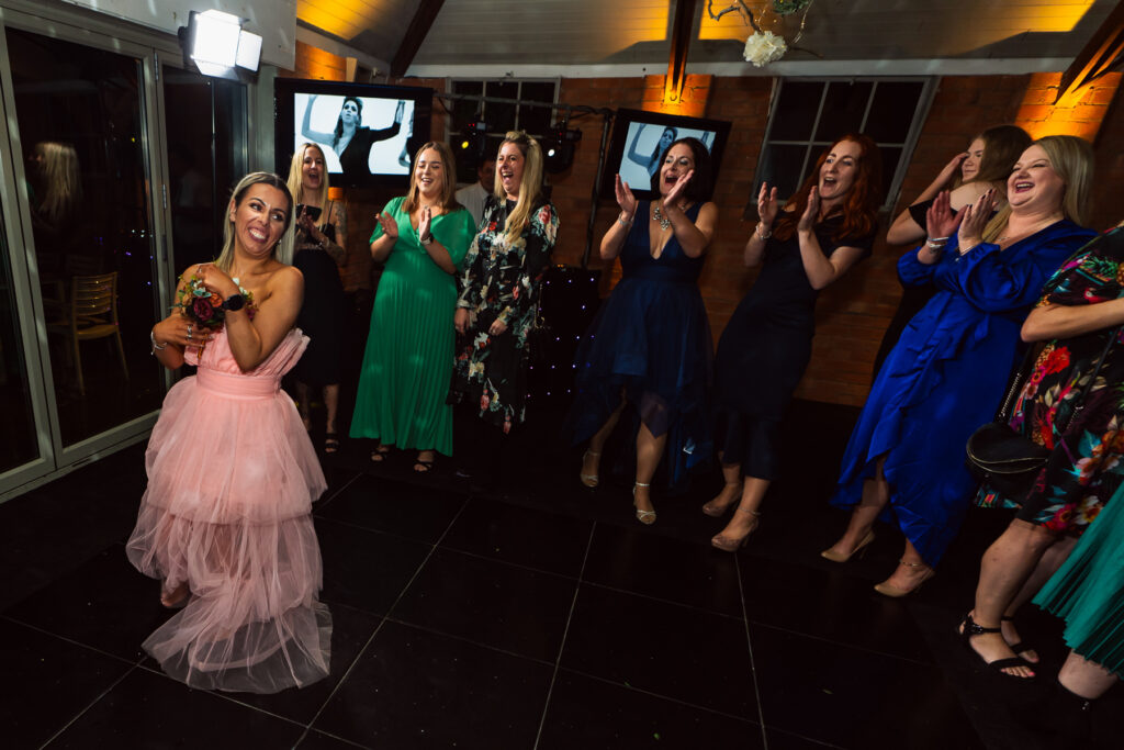 Bride throwing her flowers