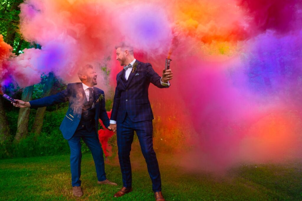 Gay couple with smoke bombs - lgbtq Wedding photos 