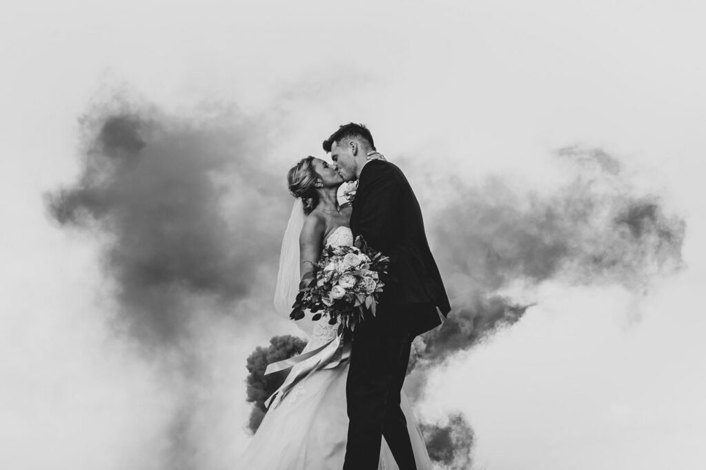 Wedding couple in smoke bombs