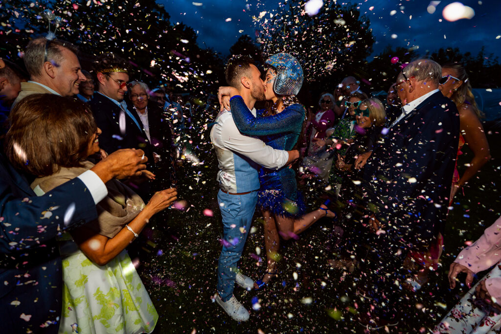 Wedding couple in confetti at night