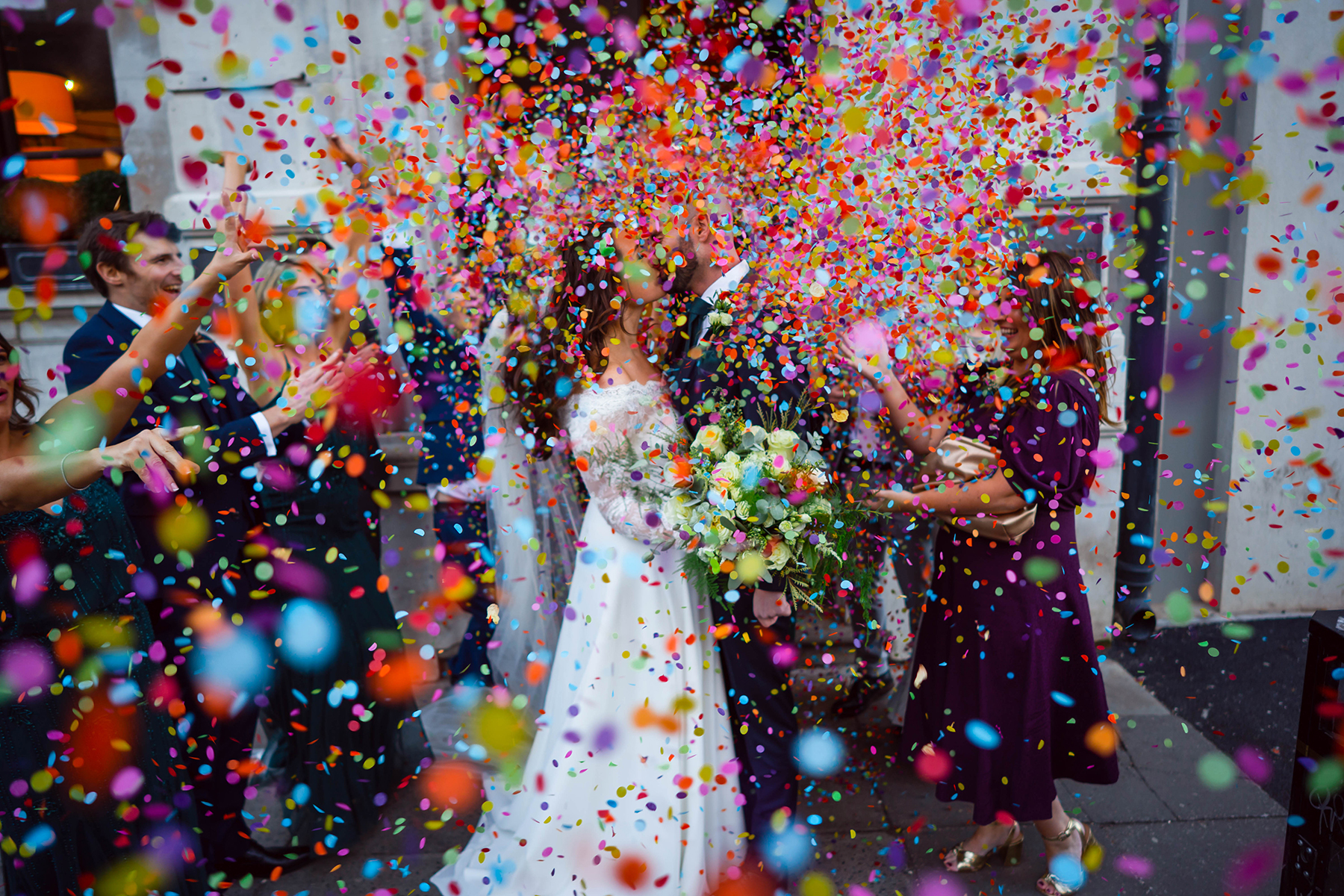 Wedding couple with colourful confetti
