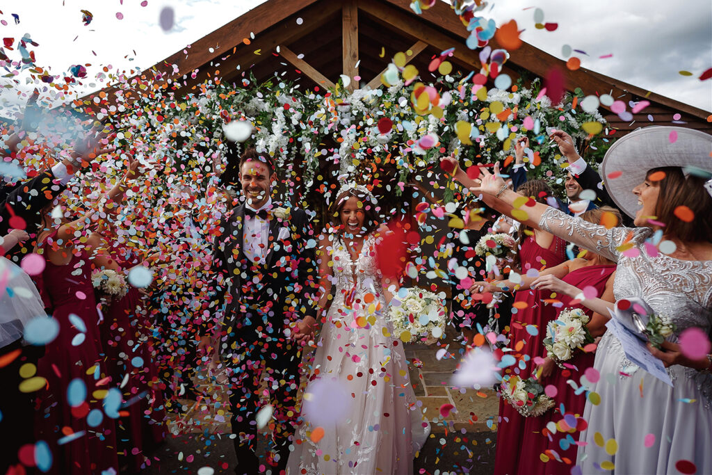 Wedding couple in confetti