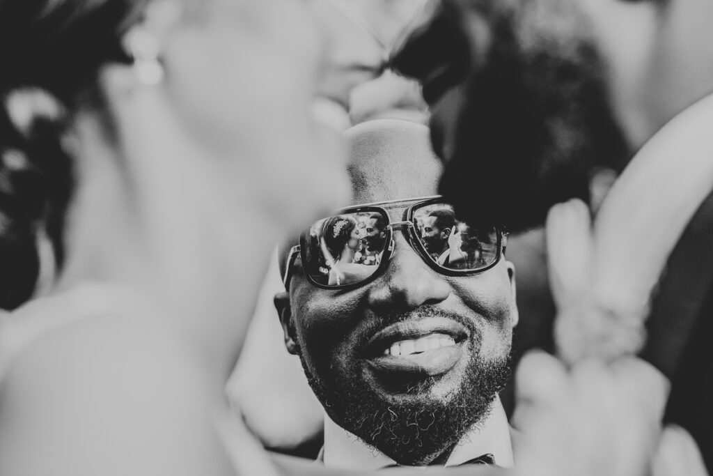 Award Winning Wedding Photographer with reflection in glasses