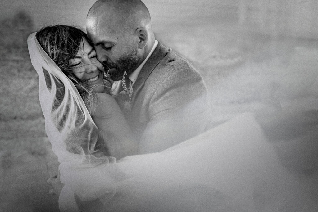 Wedding couple hugging in black and white