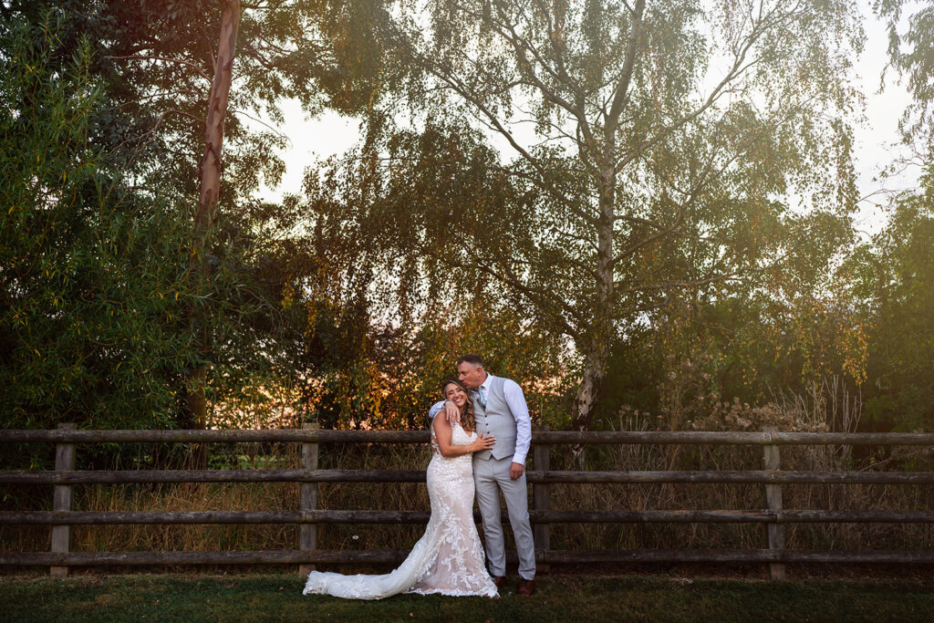 Mythe Barns Wedding Photography couple kissing in sun