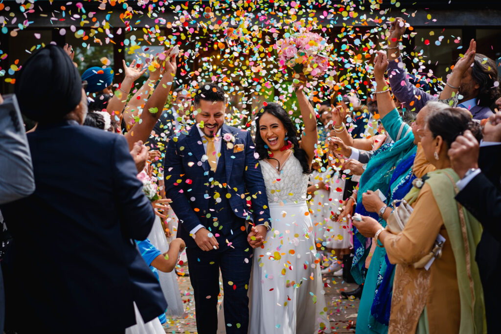 Local wedding photographer with couple outside Mythe Barns leicester