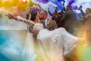 Bordesley Park wedding photography with couple in front of smoke grenades