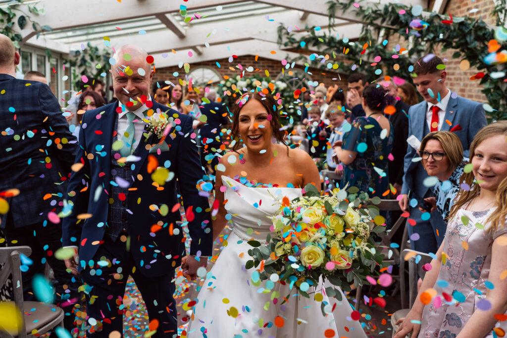 Couple in confetti at Foxtail Barns