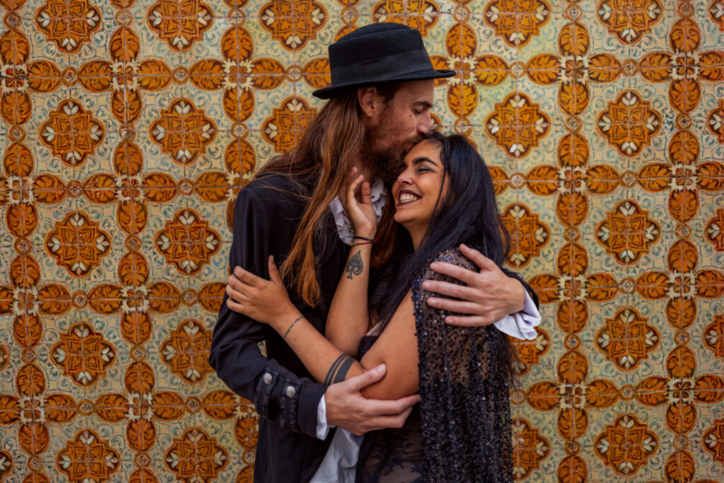 Gothic wedding couple in front of tiles in Lisbon