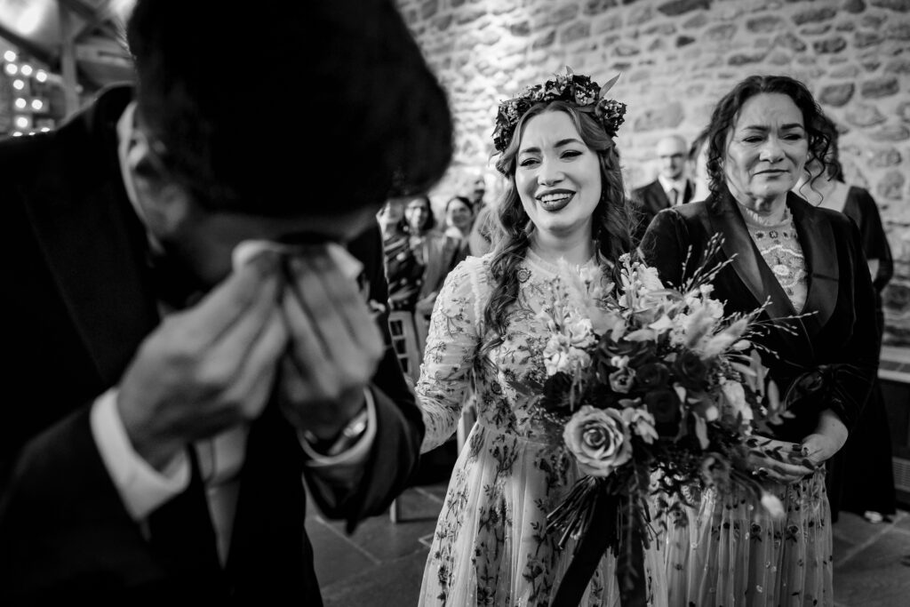 Groom crying during ceremony 